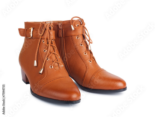 Pair of brown female boots isolated on white background