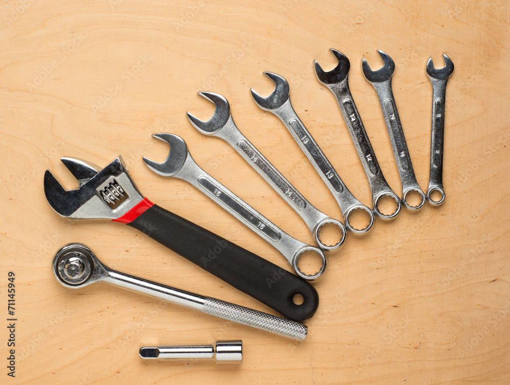 Set of tools on a wood panel Set of tools on a wood panel