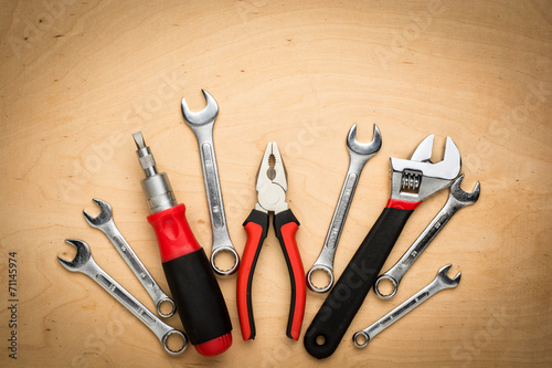 Set of tools on a wood panel