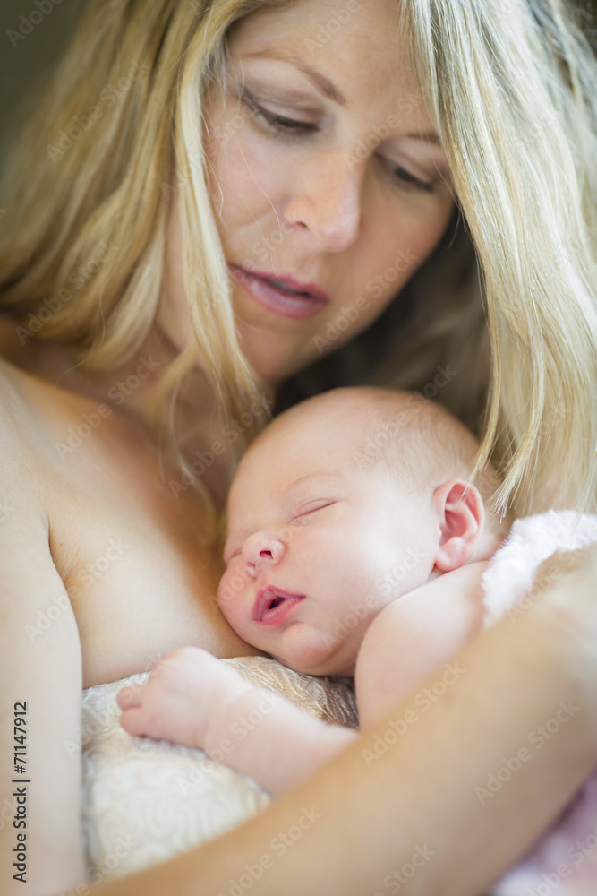 Young Beautiful Mother Holding Her Precious Newborn Baby Girl Young Beautiful Mother Holding Her Precious Newborn Baby Girl