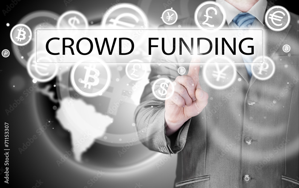 Businessman pushes virtual crowd funding button Businessman pushes virtual crowd funding button