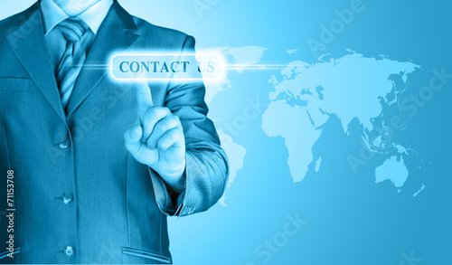 businessman hand pushing contact us button