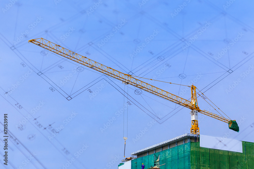 Crane working in construction on blue sky