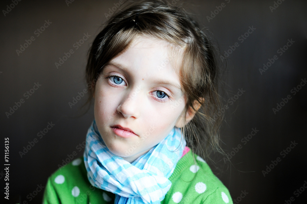 Indoor picture of diseased sad kid girl in scarf
