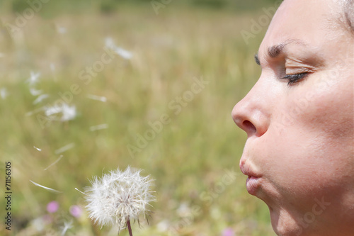 woman and a dandelion