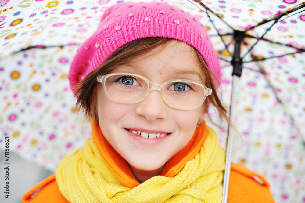 Colorful kid girl with umbrella on city street Colorful kid girl with umbrella on city street