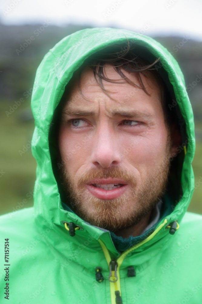 Raincoat - man outdoors in rain jacket Raincoat - man outdoors in rain jacket