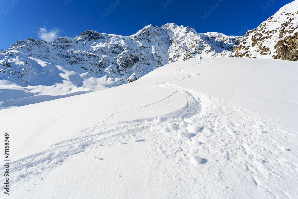 Winter mountains, ski run in Italian Alps