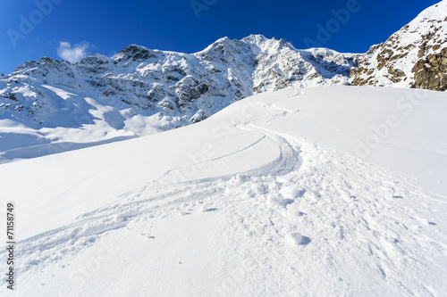 Winter mountains, ski run in Italian Alps