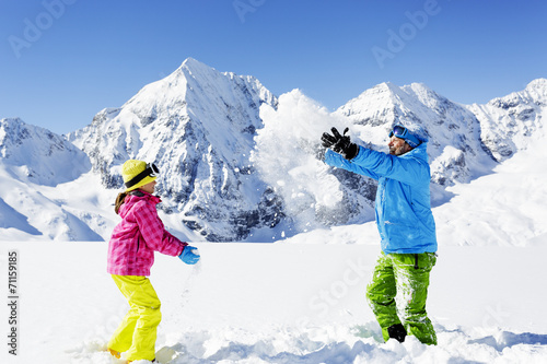 Ski, skier, sun and winter fun - skiers enjoying winter