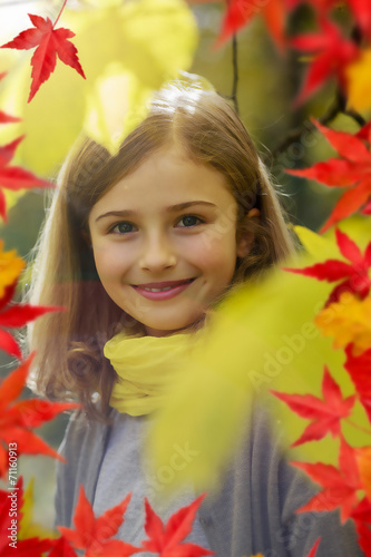 Autumn - young girl enjoying autumn