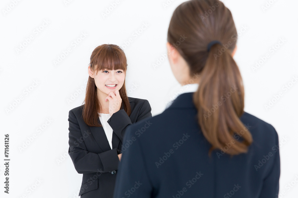 asian businesswomen talking on white background asian businesswomen talking on white background