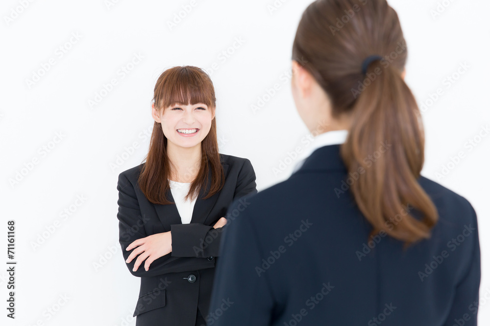 asian businesswomen talking on white background asian businesswomen talking on white background