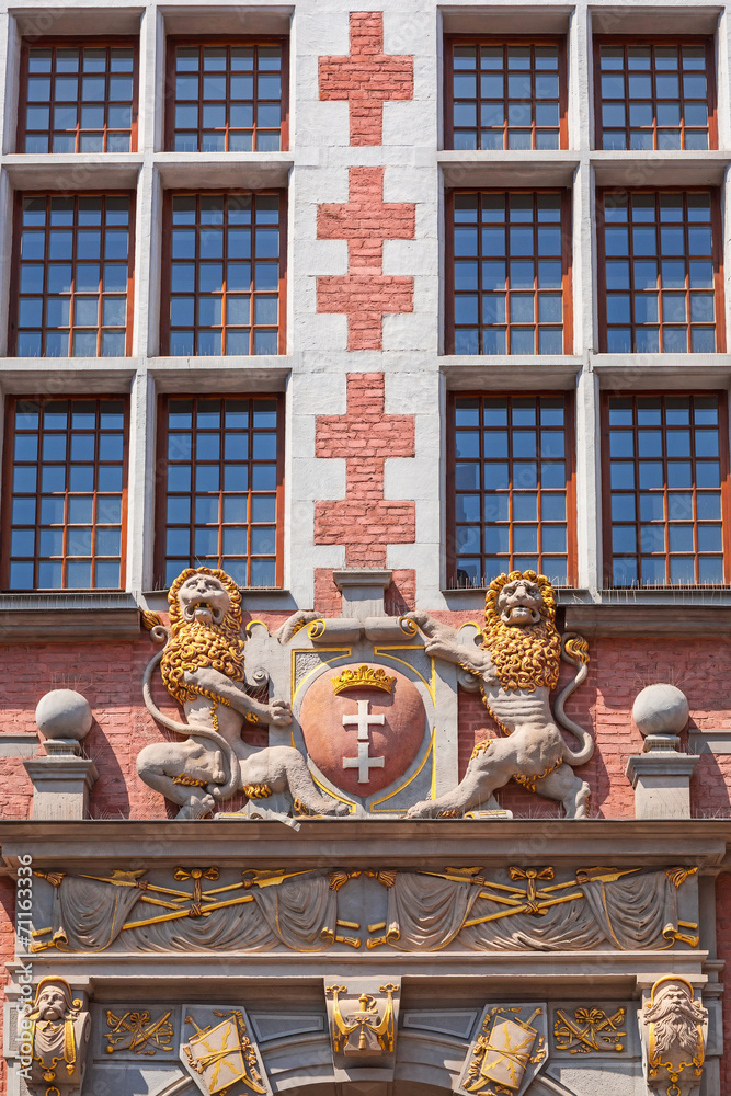 Fototapeta premium Architecture relief with two lions holding emblem of Gdansk