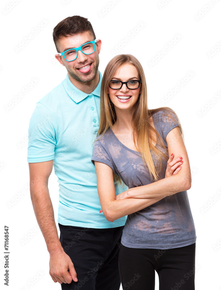 Beautiful young happy couple smiling, man and woman looking at c Beautiful young happy couple smiling, man and woman looking at c