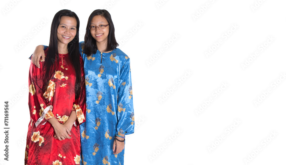 Asian Malay mother and daughter in traditional dress