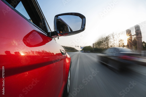 A car driving on a motorway at high speeds