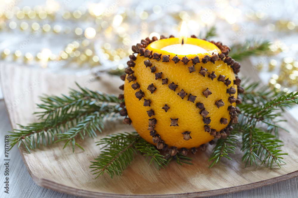 Aromatic Christmas orange with candle - obrazy, fototapety, plakaty 
