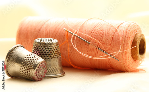 Thread bobbins and sewing thimbles