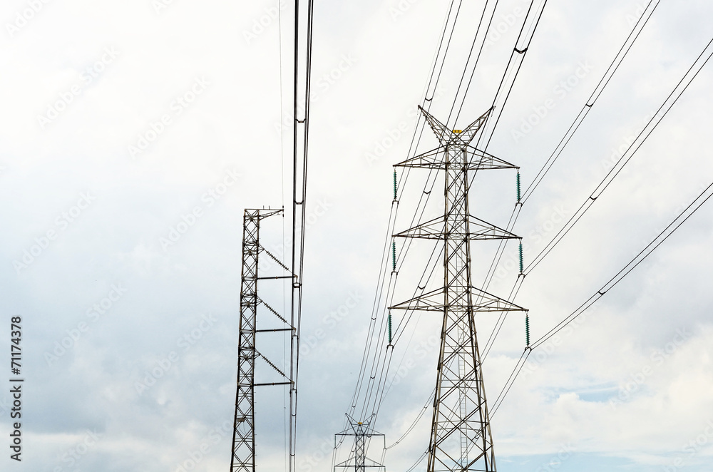 Power transmission lines against blue sky Power transmission lines against blue sky