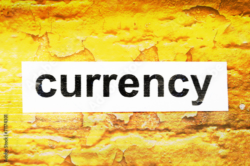 Currency text on grunge background
