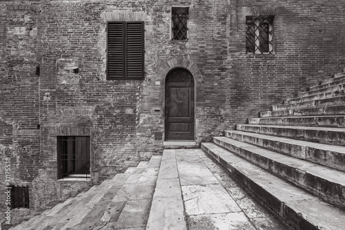 Classic Door, Windows,Wall and Staircase in Siena, Italy #71175538