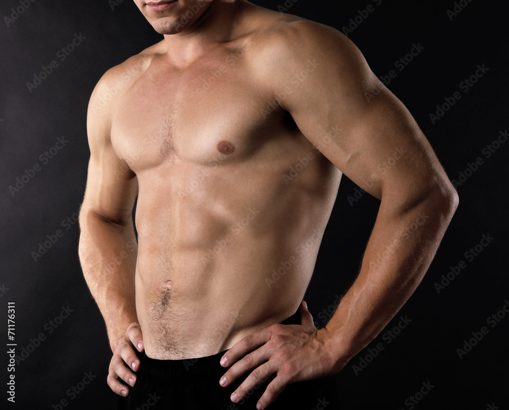 Sexy muscular man on dark background Sexy muscular man on dark background