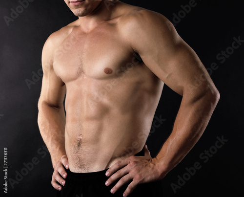 Sexy muscular man on dark background