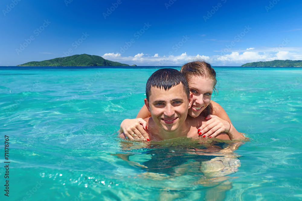 Young couple on beach holiday Young couple on beach holiday