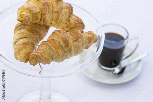 French Croissants on glass dish with coffee