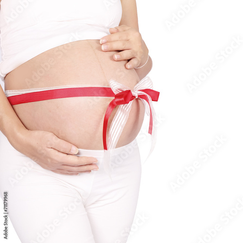 Wallpaper Mural Belly of a pregnant woman with red and white ribbon Torontodigital.ca