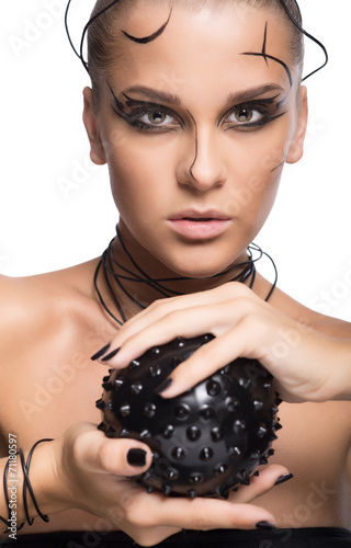 Beautiful cyber girl with black  prickly ball isolated on white