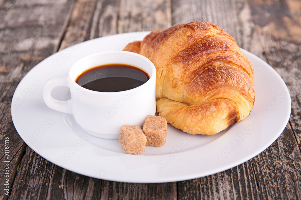coffee cup and croissant coffee cup and croissant
