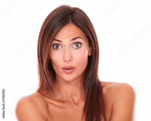 Surprised young woman looking at camera