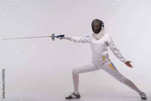 Young woman engaging in fencing