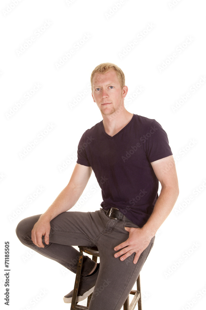 man in purple shirt sit on stool man in purple shirt sit on stool