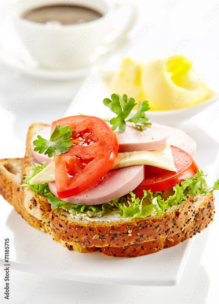 breakfast sandwich with sliced sausage and tomato breakfast sandwich with sliced sausage and tomato