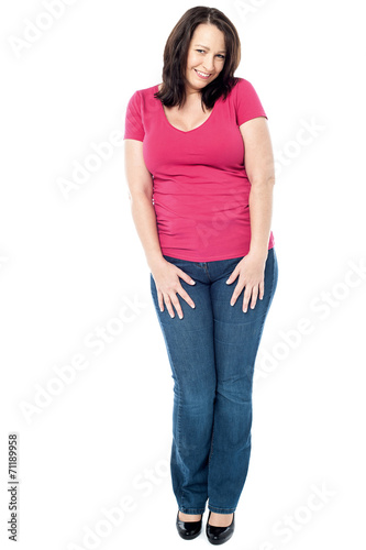 Shy middle aged woman isolated on white © stockyimages