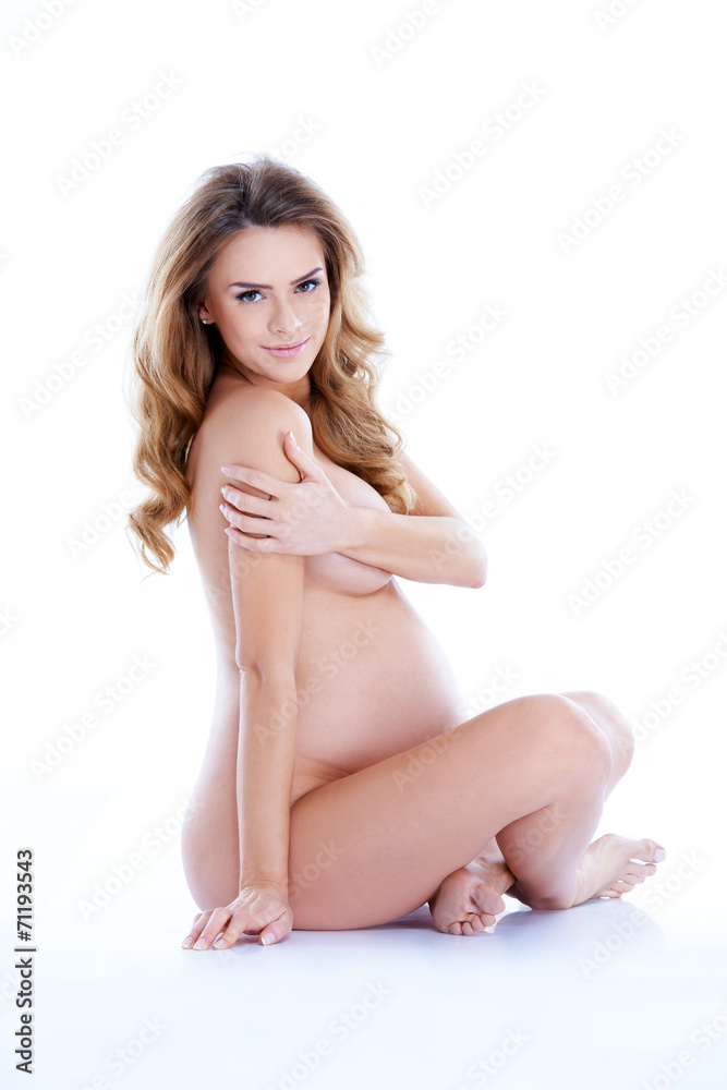 Obraz premium Nude Pregnant Woman Sitting Cross Legged