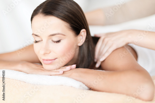 beautiful woman in spa salon getting massage