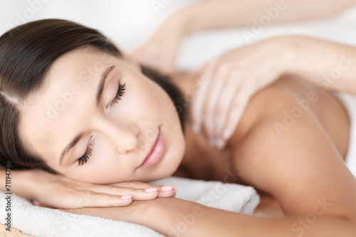 beautiful woman in spa salon getting massage