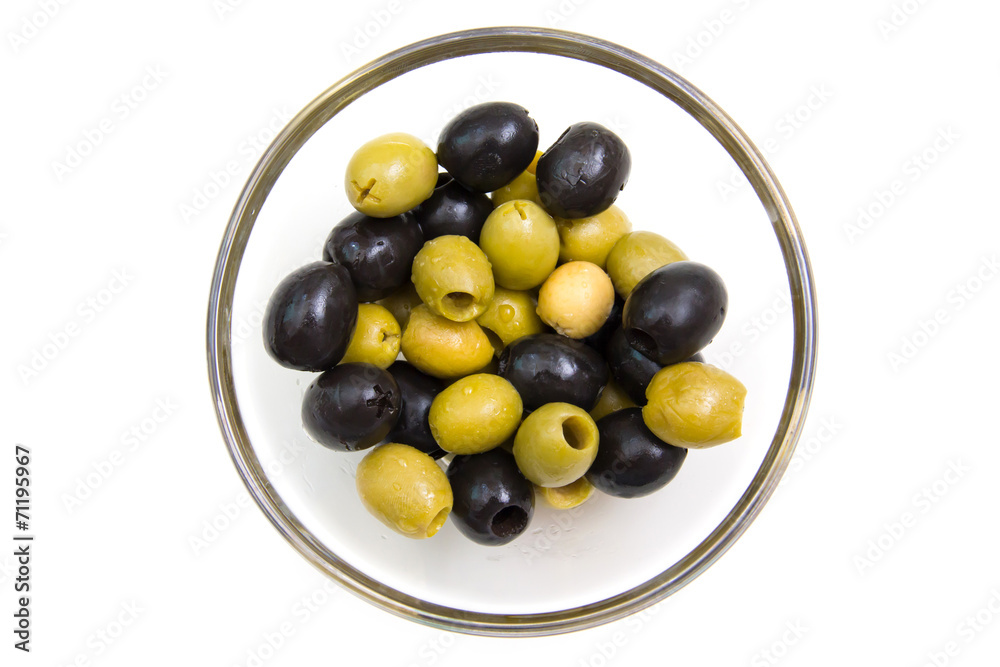 Green and black olives on white background from above Green and black olives on white background from above