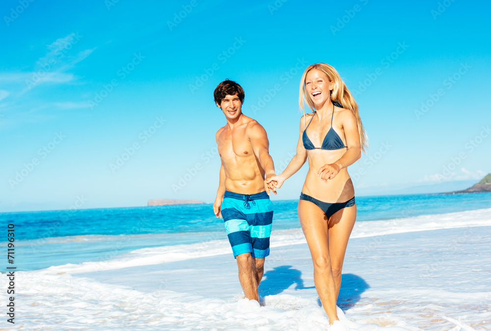 Atractive Couple Having Fun on the Beach