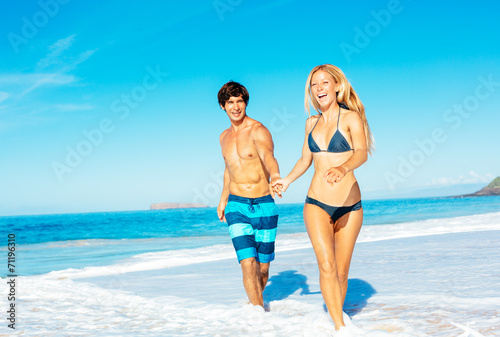 Atractive Couple Having Fun on the Beach