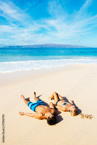 Fototapeta Naklejka Na Ścianę i Meble -  Couple Relaxing on the Beach