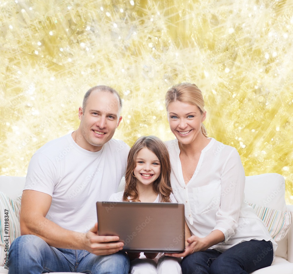 smiling family with laptop smiling family with laptop