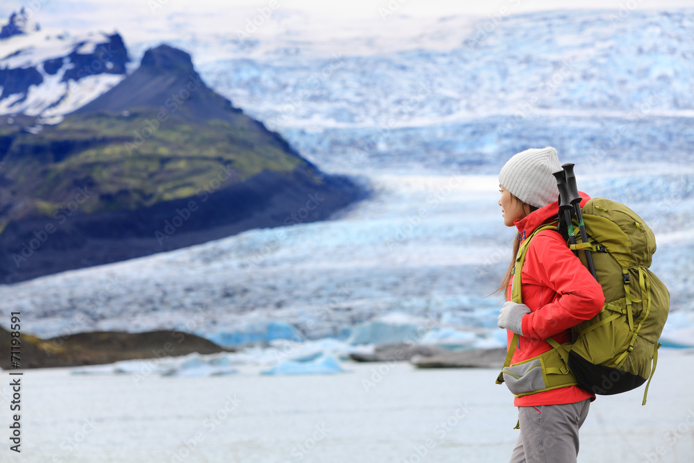 Adventure hiking woman by glacier on Iceland