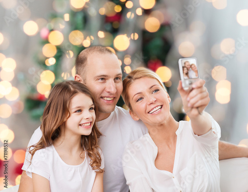 happy family with camera at home