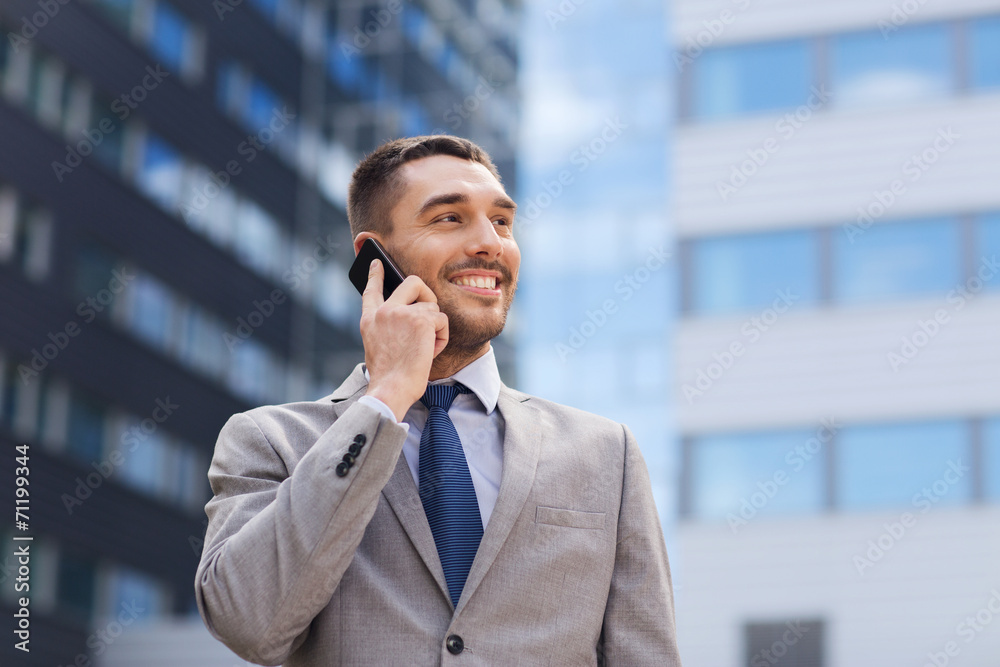 smiling businessman with smartphone outdoors smiling businessman with smartphone outdoors