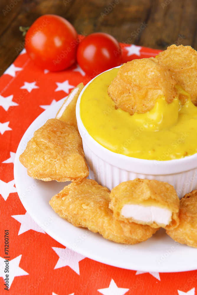 Chicken nuggets with sauce on table close-up Chicken nuggets with sauce on table close-up